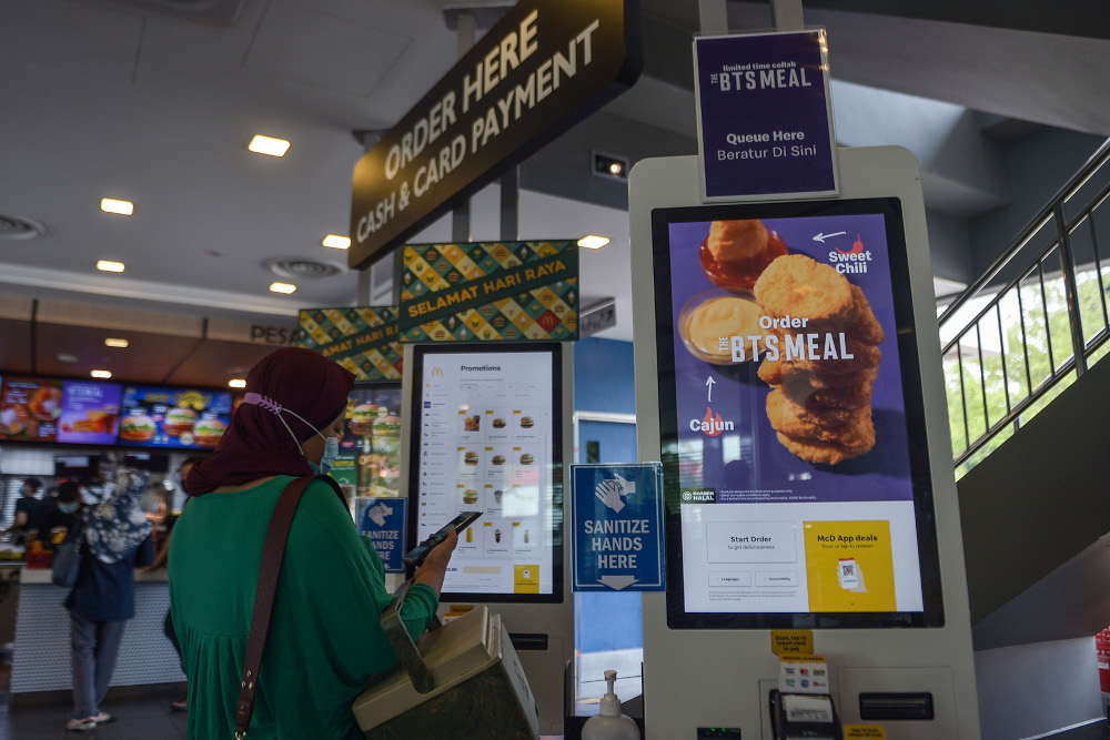 A customer gets ready to order at the McDonald’s outlet in Seksyen 3, Shah Alam May 26, 2021. — Picture by Miera Zulyana