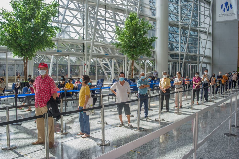 People wait in line to receive their Covid-19 jab at the Malaysia International Trade and Exhibition Centre in Kuala Lumpur May 31, 2021. u00e2u20acu201d  Picture by Shafwan Zaidon