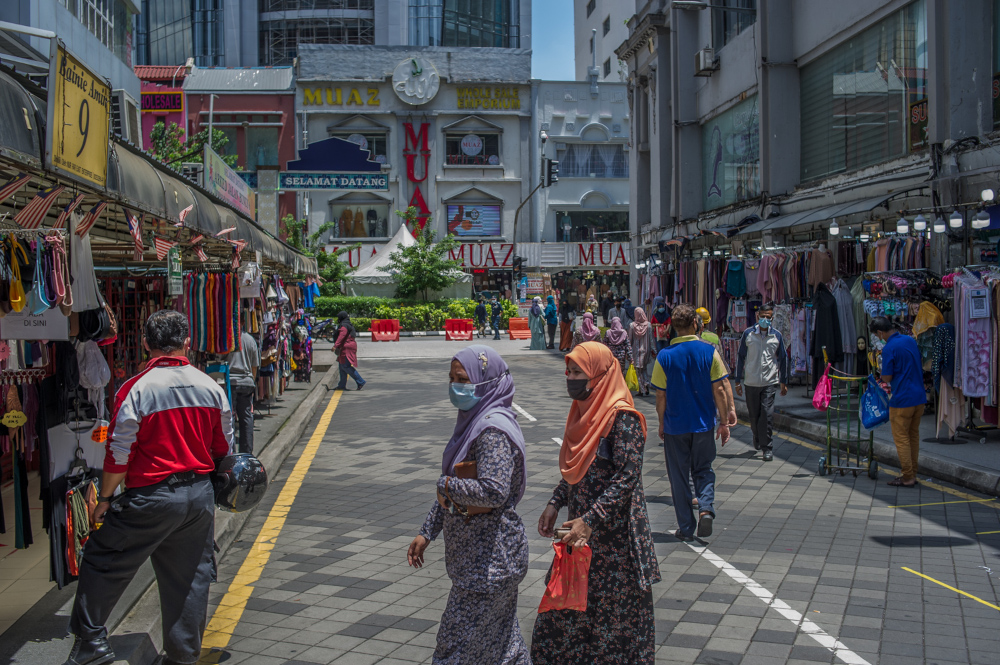 People wearing face masks throng Jalan Tuanku Abdul Rahman to do some shopping in Kuala Lumpur May 10, 2021. u00e2u20acu201d Picture by Shafwan Zaidon