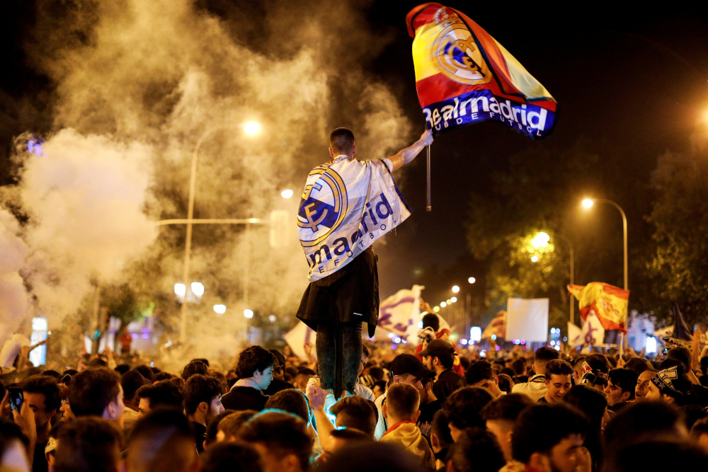 Real Madrid fans celebrate near the Cibeles fountain in central Madrid after their team won the Champions League, May 27, 2018. u00e2u20acu201d Reuters pic 