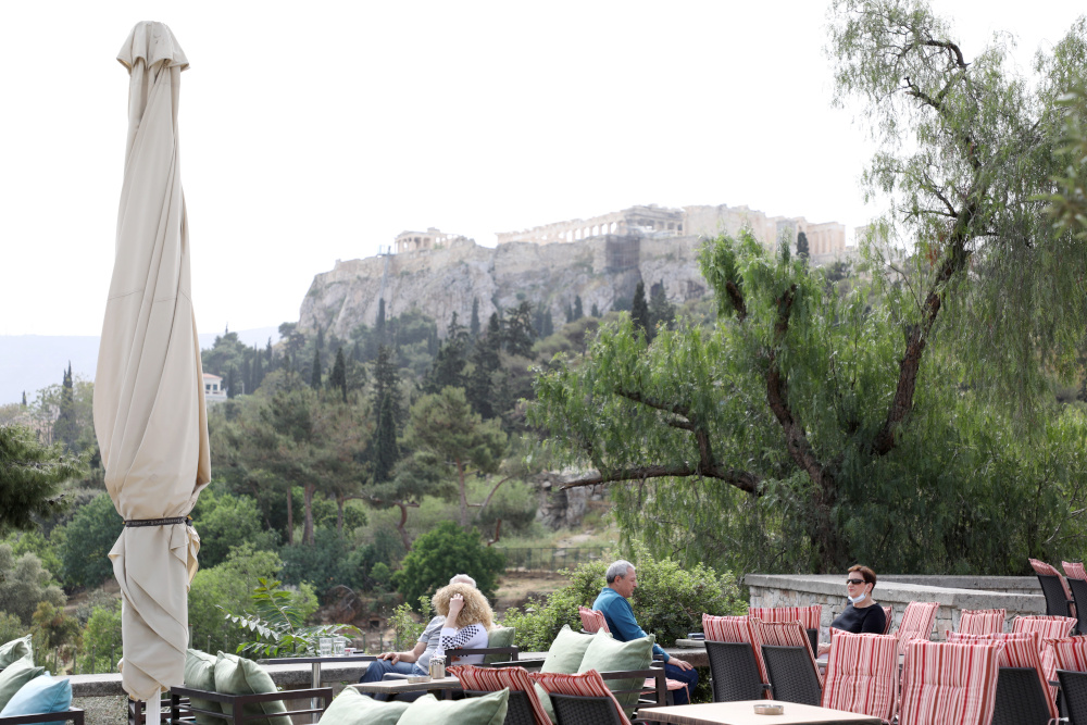 People sit at an outdoor cafe in Thiseio, as restaurants and cafes in Greece open after six months of lockdown, amid the coronavirus disease (Covid-19) outbreak, in Athens May 3, 2021. u00e2u20acu201d Reuters pic