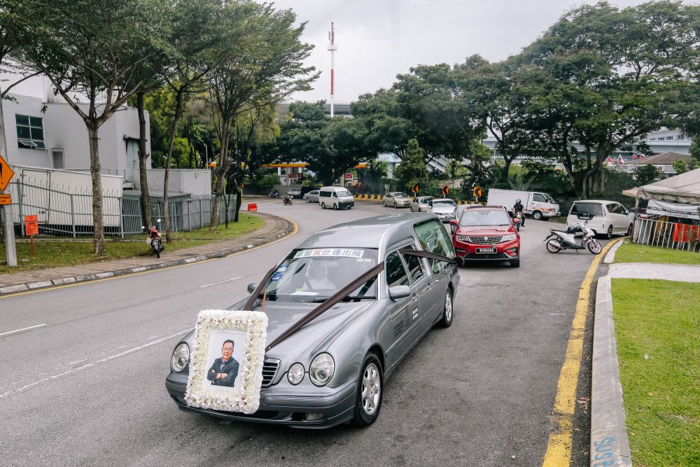 Wong’s funeral hearse and cortege departs from the Xiao En Centre in Jalan Kuari to the Cheras Crematorium May 17, 2021. — Picture by Firdaus Latif