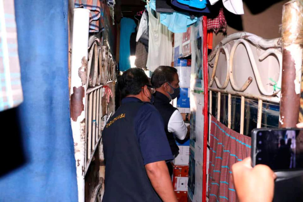 Human Resources Datuk Seri M. Saravanan inspects a workersu00e2u20acu2122 dormitory, which glove-maker Brightway Holdings confirms is one of its facilities, in Selangor, December 21, 2020, in this image obtained via social media. u00e2u20acu201d Malaysia Ministry of Human Resour