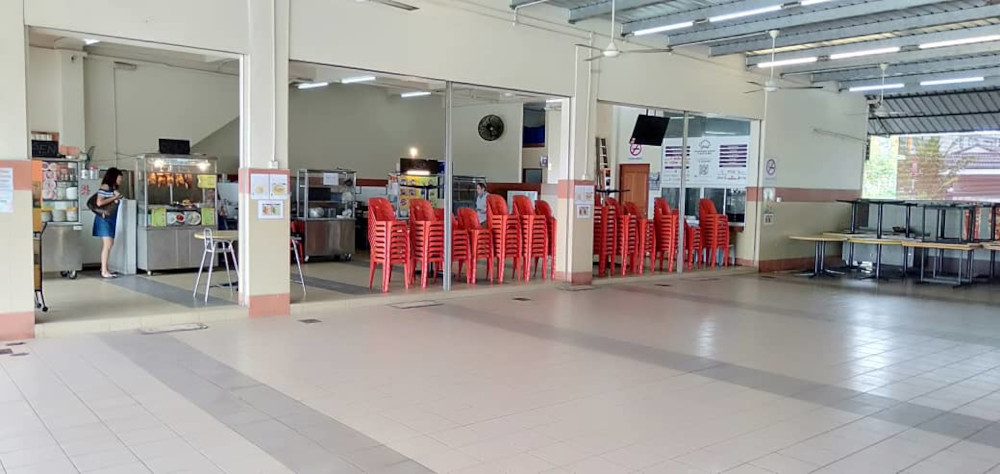 File photo showing a coffeeshop with their tables and chairs tidied away as per the no-dine in directive. u00e2u20acu201d Borneo Post Online pic 
