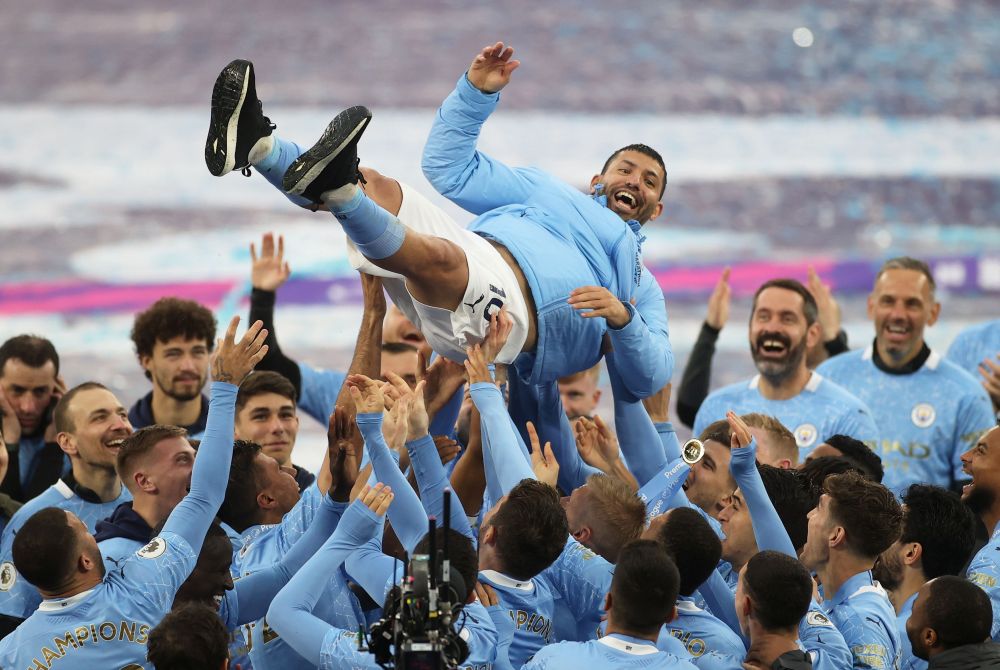 Manchester City's Sergio Aguero is thrown in the air by teammates as they celebrate winning the Premier League after his last match at the Etihad Stadium May 23, 2021. u00e2u20acu201d Reuters picnn