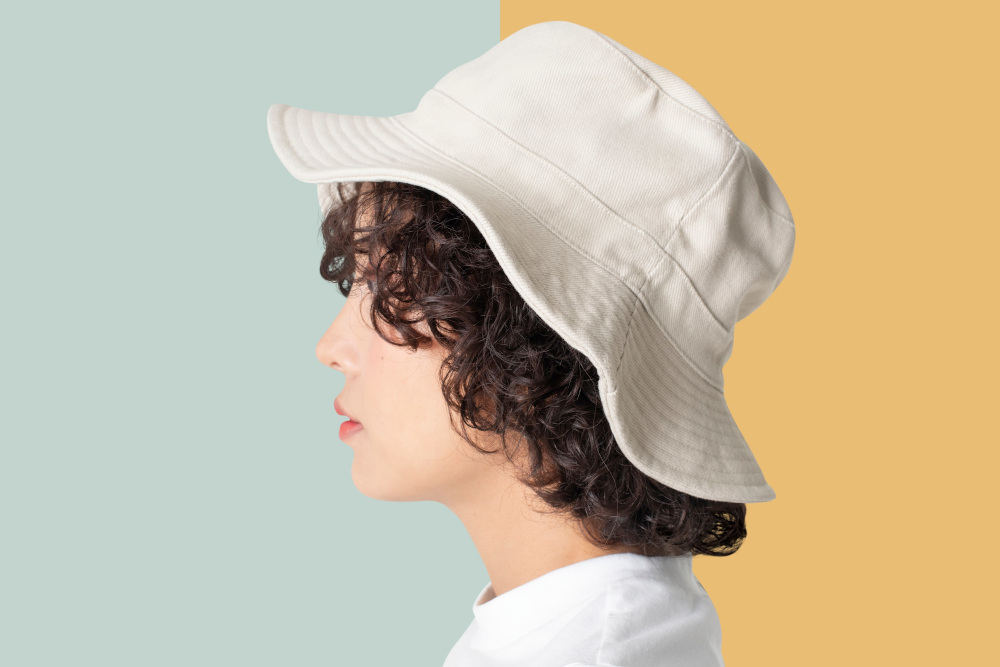 Will the bucket hat be this summer's go-to headgear? u00e2u20acu201d Rawpixel.com/Shutterstock pic via ETX Studio