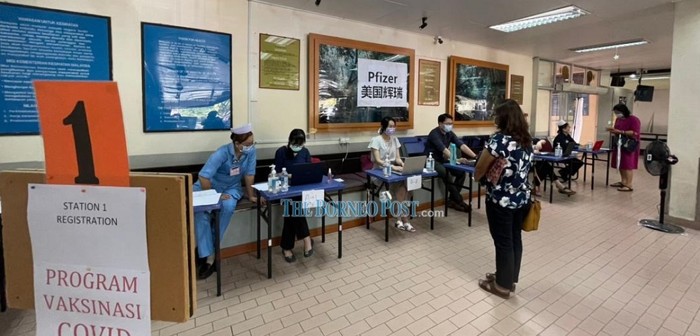 The registration counter for the Covid-19 vaccination. u00e2u20acu2022 Borneo Post pic