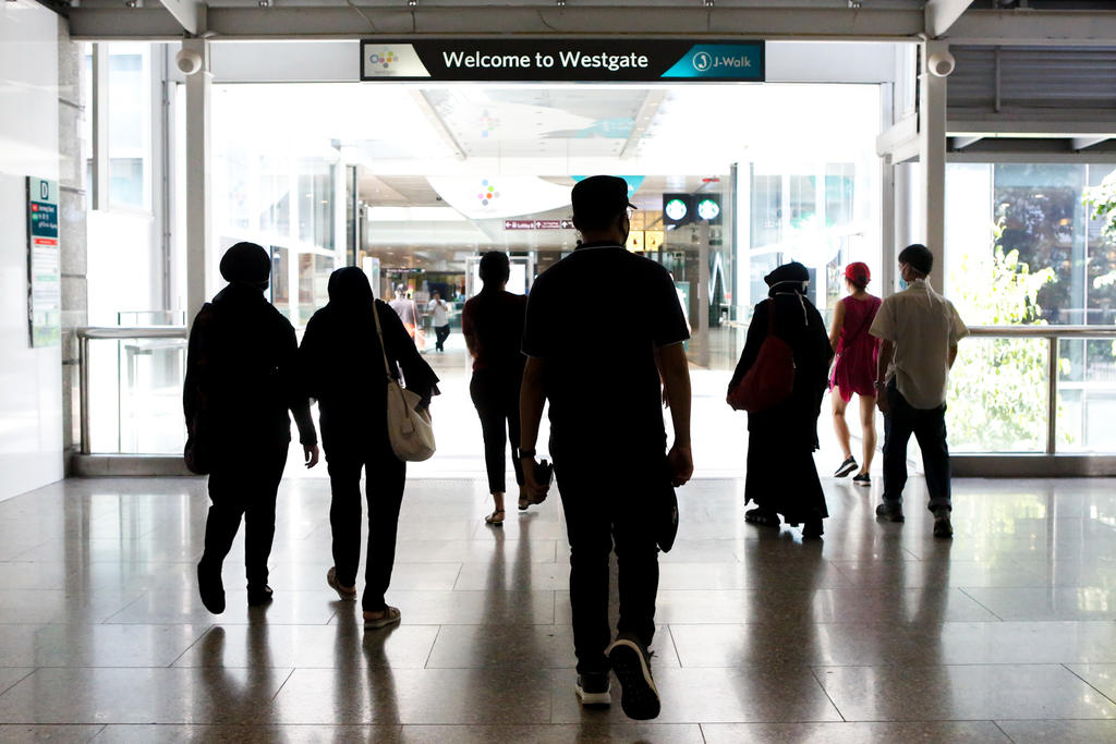 A 21-year-old Singaporean man who works as a waiter at Pizza Hut in Westgate mall was among the 24 new cases in the community reported on May 24, 2021. u00e2u20acu2022 TODAY file pic