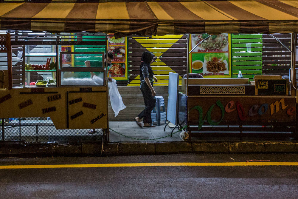 Traders in Kuala Lumpur at the end of the first day of tightened MCO 3.0 SOPs which came into effect May 25, 2021, allowing businesses to operate from 8am to 8pm. u00e2u20acu2022 Picture by Hari Anggara