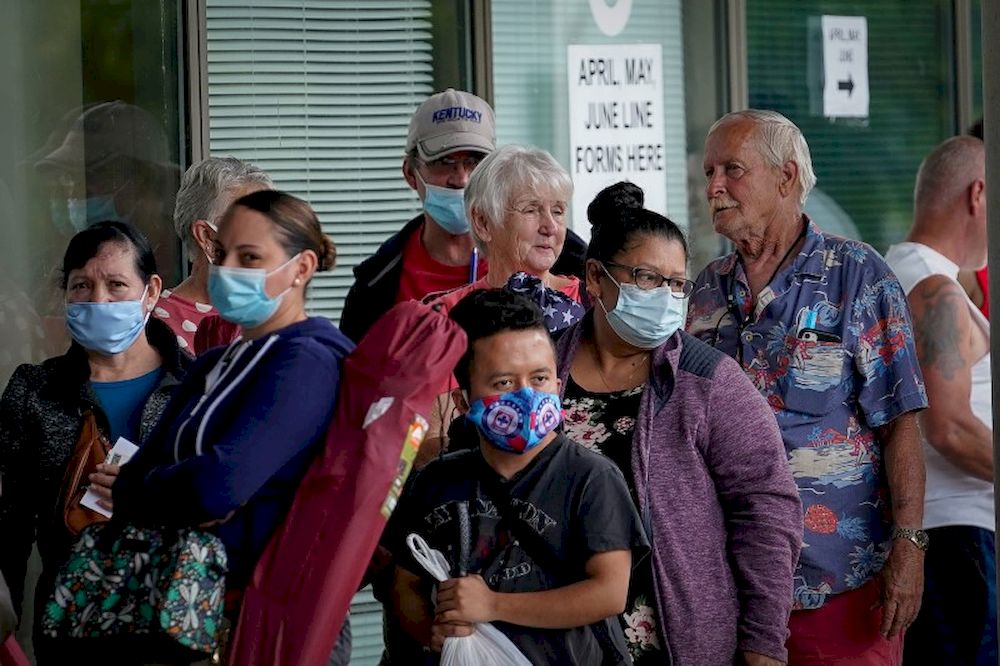 People line up outside a Kentucky Career Center hoping to find assistance with their unemployment claim in Frankfort, Kentucky, US, June 18, 2020. u00e2u20acu201d Reuters pic