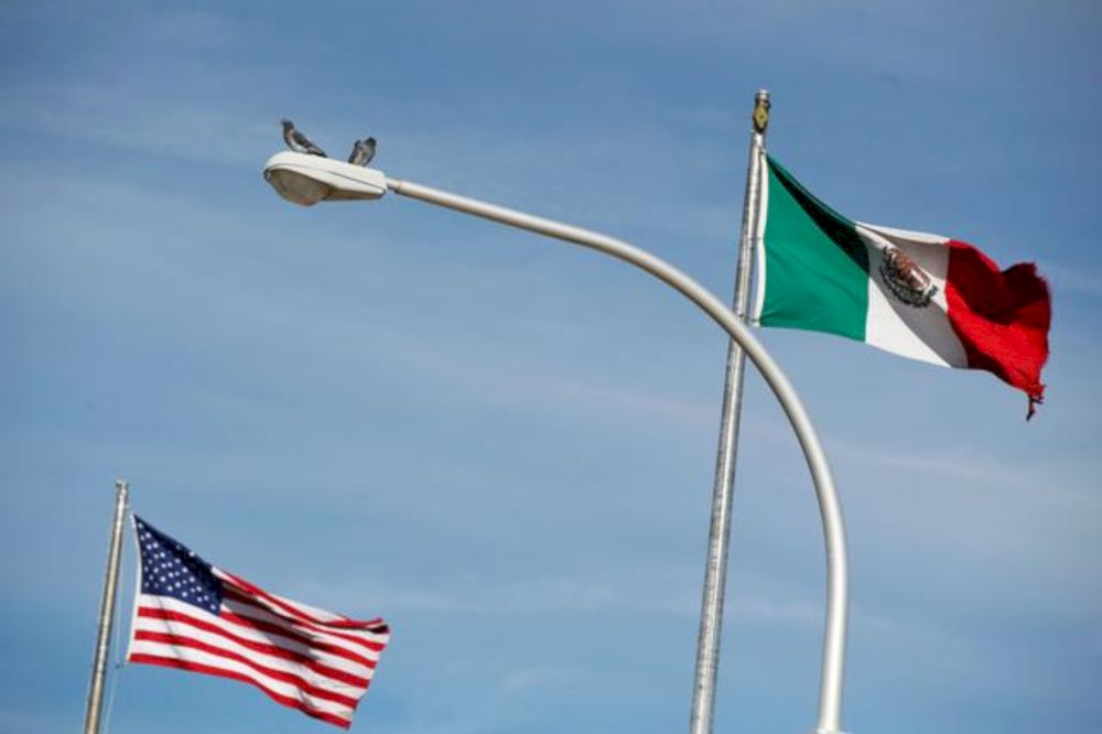 The US flag (left), and the Mexicou00e2u20acu2122s flag are pictured on the international border bridge Paso del Norte in between El Paso US and Ciudad Juarez in Ciudad Juarez, Mexico December 28, 2016. u00e2u20acu201d Reuters pic