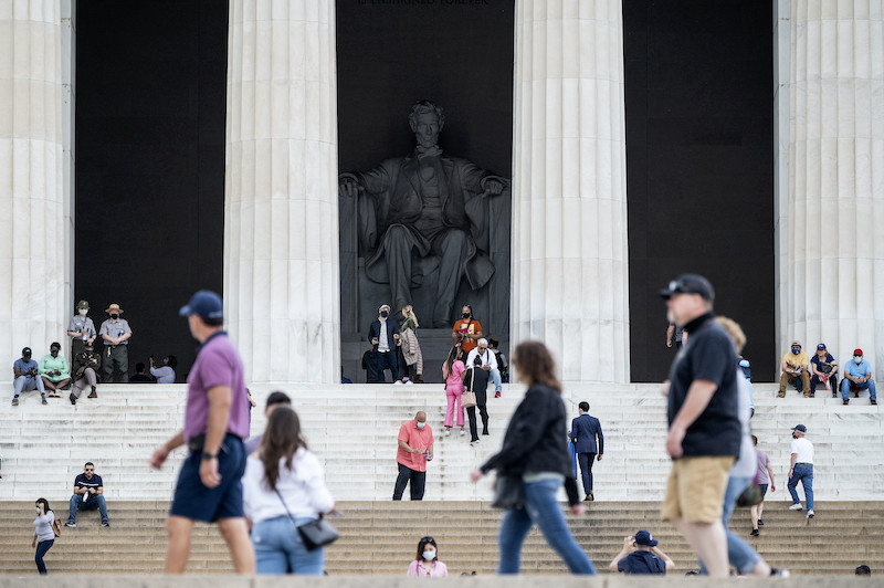 Tourists, some in face masks while others are not, visit the Lincoln Memorial in Washington, DC, on May 14, 2021. u00e2u20acu201d Reuters pic