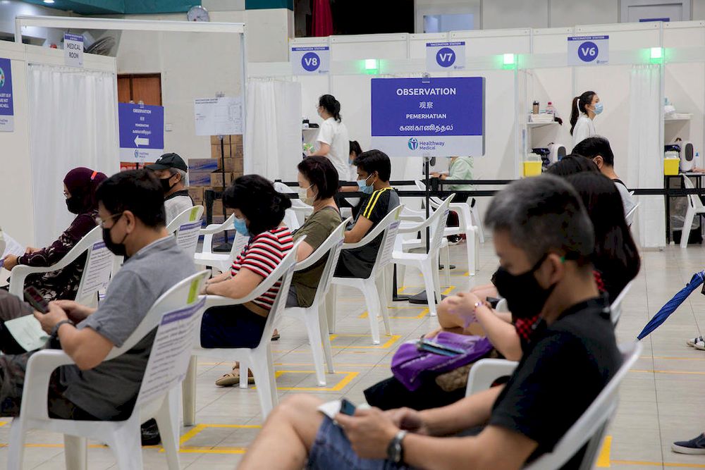 People waiting to get their jabs at a Covid-19 vaccination centre in Yew Tee Community Centre on April 21, 2021. u00e2u20acu201d TODAY pic