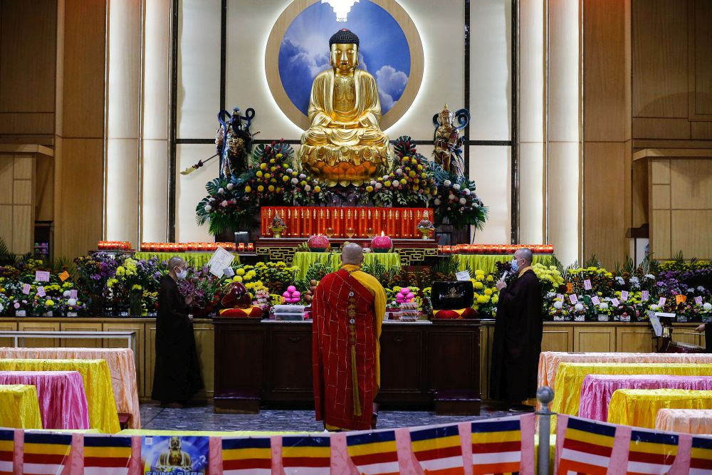 Monks perform a prayer ritual on Wesak Day at the Wat Chaiyamangalaram Buddhist Temple in George Town May 26, 2021. — Picture by Sayuti Zainudin