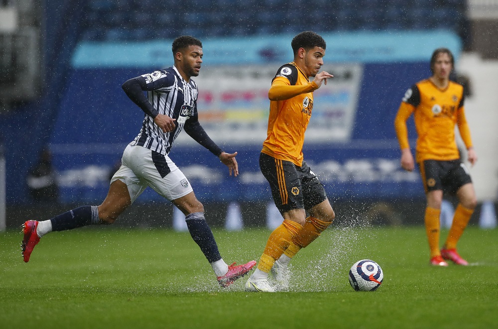 West Bromwich Albion's Darnell Furlong in action with Wolverhampton Wanderers' Morgan Gibbs-White, May 4, 2021. u00e2u20acu2022 Pool via Reuters