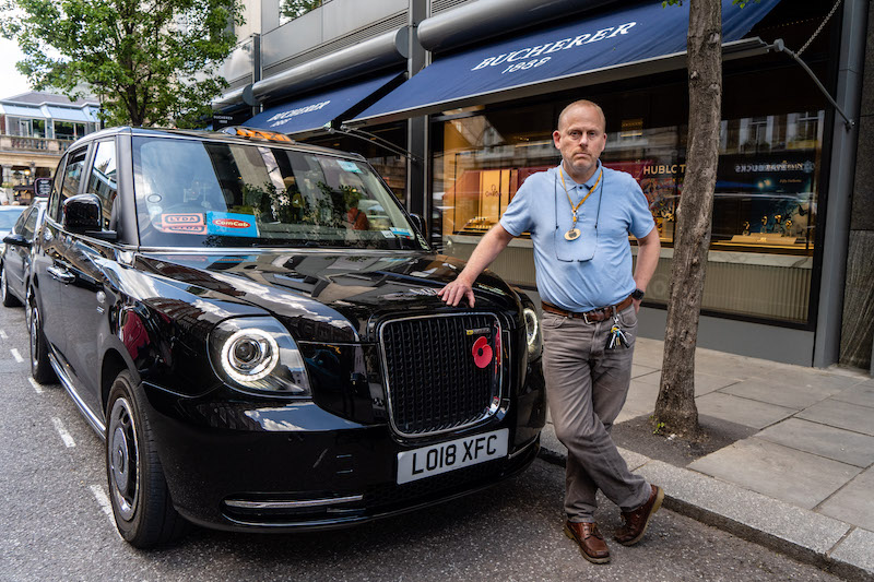 London taxi driver Barry Ivens, 53, poses for a photograph next to his cab in central London on May 27, 2021. u00e2u20acu201d AFP pic                