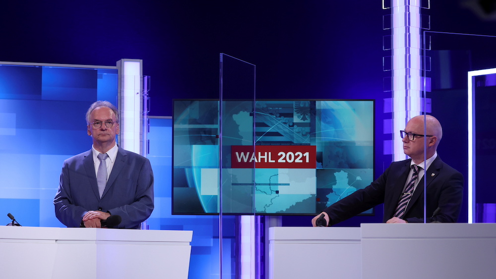 Far-right Alternative for Germany (AfD) main candidate Oliver Kirchner (right) and Reiner Haseloff, top candidate of his conservative CDU party, attend a televised debate in Magdeburg, Germany June 6, 2021. u00e2u20acu201d Ronny Hartmann/Pool via Reuters