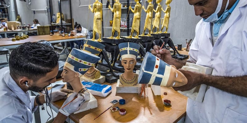 Technicians paint replicas of Ancient Egyptian busts of Queen Nefertiti being fabricated at the Egyptian government's Konouz (Treasures) factory reproducing replicas of Ancient Egyptian items. u00e2u20acu201d AFP pic