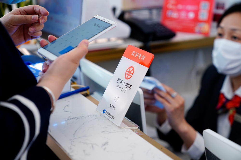 A sign indicating digital yuan, also referred to as e-CNY, is pictured at a shopping mall in Shanghai May 5, 2021. u00e2u20acu201d Reuters pic