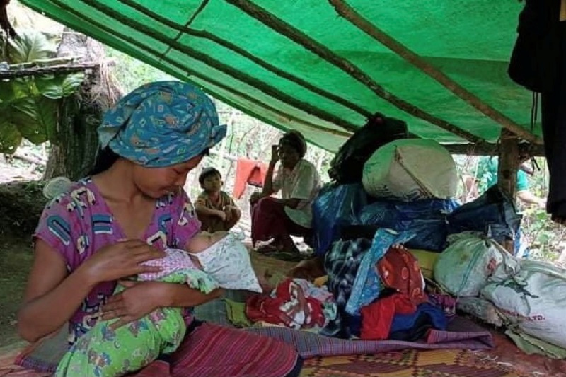 Woman displaced by fighting in eastern Myanmar feeds a baby at a forest camp in Kayah State May 26, 2021. u00e2u20acu201d Reuters pic