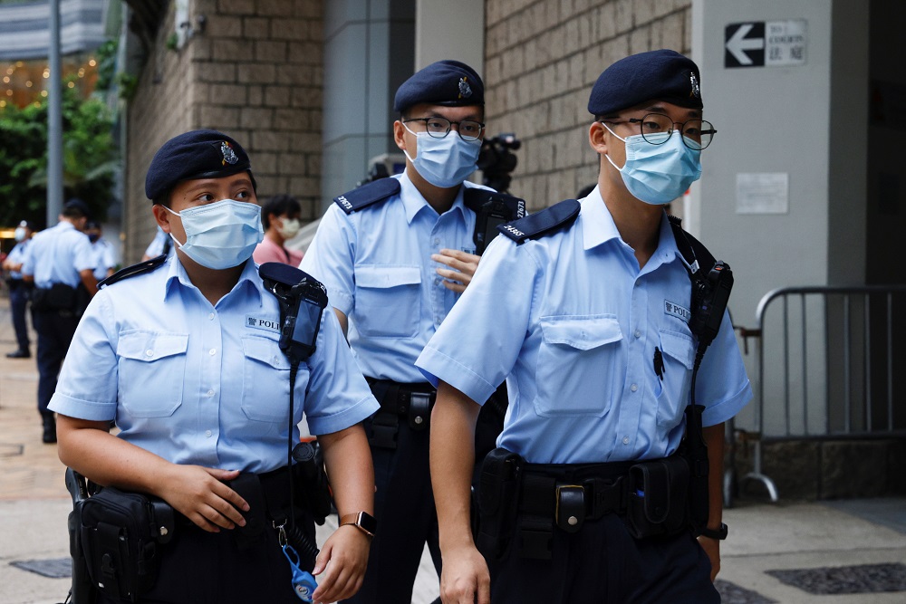 Police stand guards as a prison van arrive High Court on the first day of trial of Tong Ying-kit, the first person charged under a new national security law, in Hong Kong June 23, 2021. u00e2u20acu201d Reuters pic