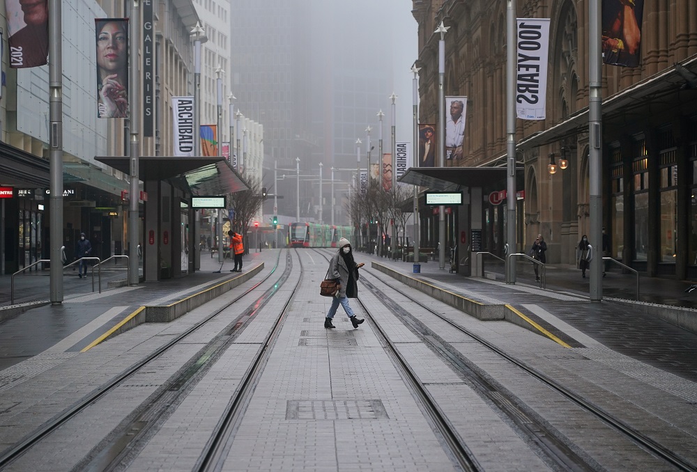 A pedestrian wearing a protective face mask walks past light rail platforms devoid of waiting passengers in the city centre at morning commute hour in Sydney June 30, 2021. u00e2u20acu201d Reuters pic