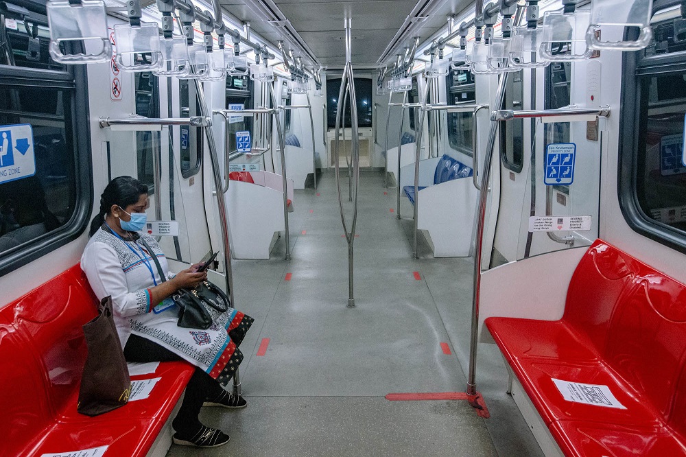 A passenger dons a face mask during a ride on the LRT train in Kuala Lumpur June 1, 2021. u00e2u20acu201d Picture by Firdaus Latif