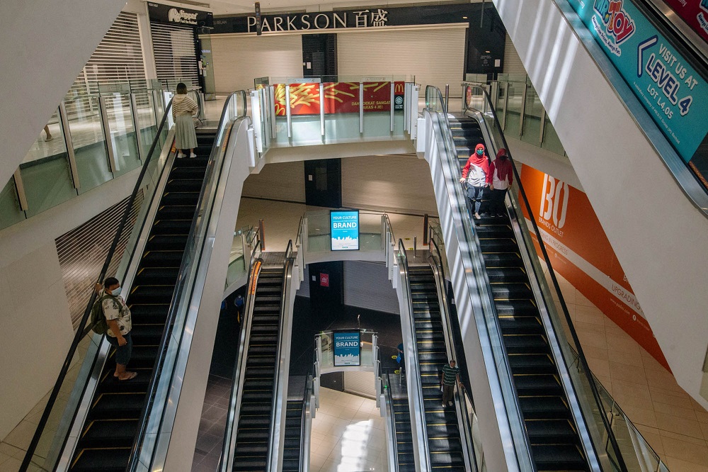 Visitors take the escalator at to the NU Sentral shopping mall in Kuala Lumpur June 2, 2021. u00e2u20acu201d Picture by Firdaus Latif