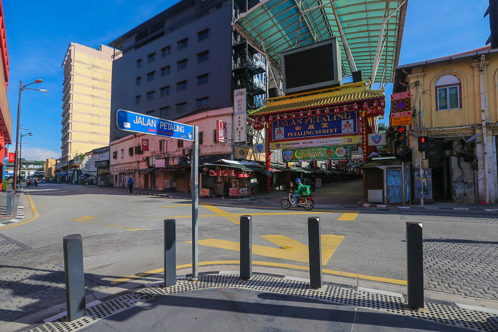 A GrabFood rider is pictured riding past Petaling Street in Kuala Lumpur June 3, 2021. u00e2u20acu201d Picture by Yusof Mat Isa 