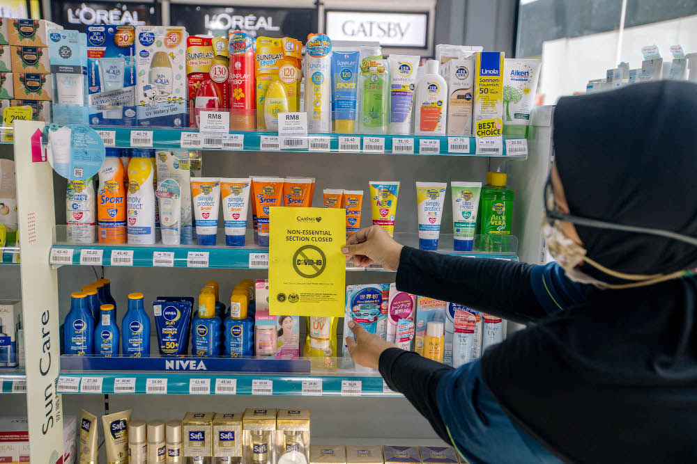 A section of a Caring pharmacy is seen in Kuala Lumpur June 4, 2021. The non-essential sections which selling hair colours, suncare, facial masks and men’s hair gel are closed due to the Full Movement Control Order (FMCO). — Picture by Firdaus Latif