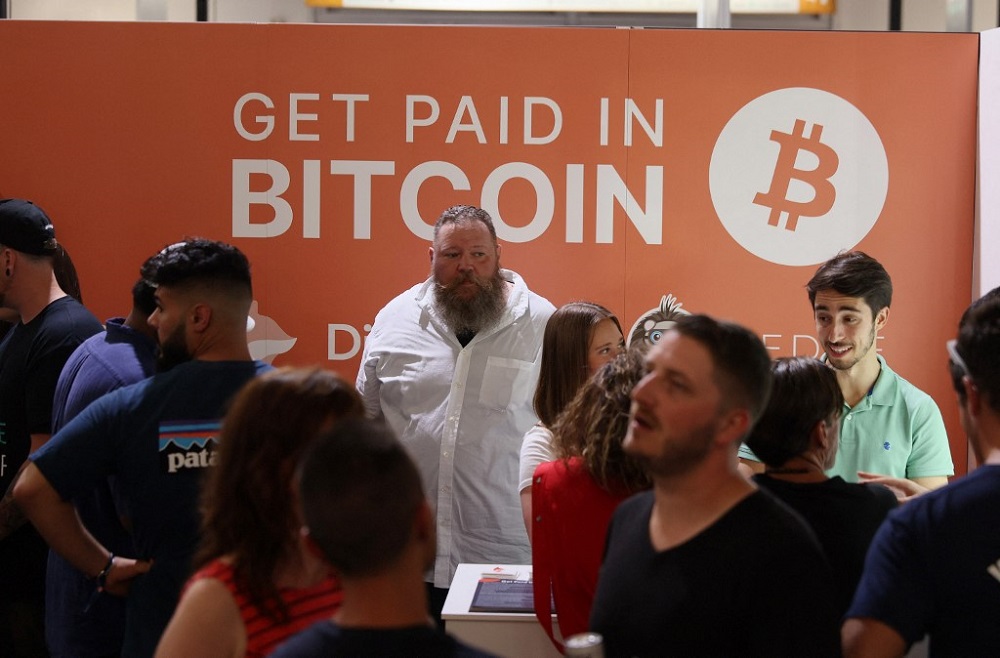 A man works in the Digifox booth setup at the Bitcoin 2021 Convention, a crypto-currency conference held at the Mana Convention Centre in Wynwood, Miami June 4, 2021. u00e2u20acu201d AFP pic 