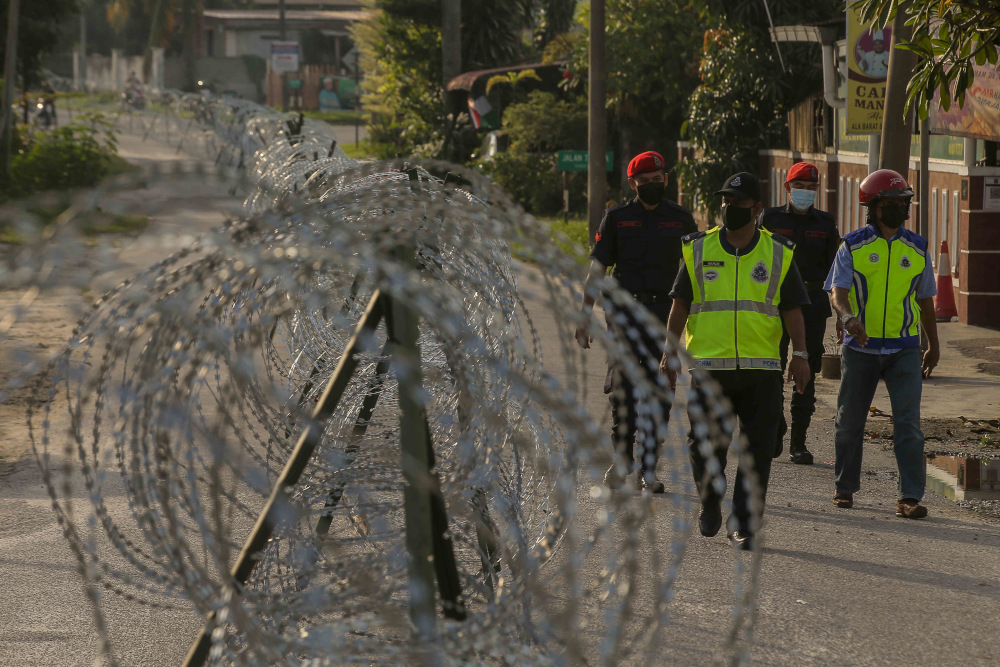 Barbed wire is seen around Kampung Datou00e2u20acu2122 Ahmad Said Tambahan 2 in Mukim (sub-district) Ulu Kinta following the implementation of enhanced movement control order (EMCO) to curb the spread of Covid-19 June 6, 2021. u00e2u20acu201d Picture by Farhan Najib  