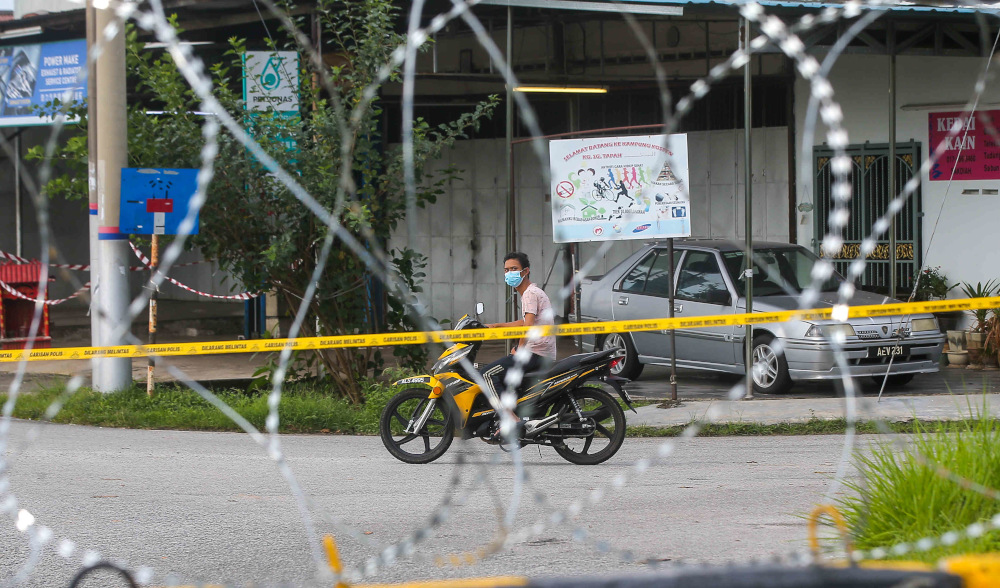Barbed wire is seen around Kampung Datou00e2u20acu2122 Ahmad Said Tambahan 2 in Mukim (sub-district) Ulu Kinta following the implementation of enhanced movement control order (EMCO) to curb the spread of Covid-19 June 6, 2021. u00e2u20acu201d Picture by Farhan Najib  