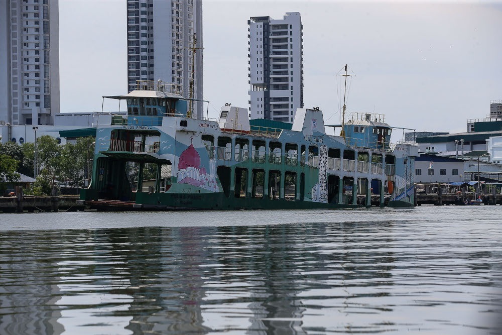 A Penang ferry is seen partly submerged near the Bagan Dalam Drydock on June 6, 2021. u00e2u20acu201d Picture by Sayuti Zainudin