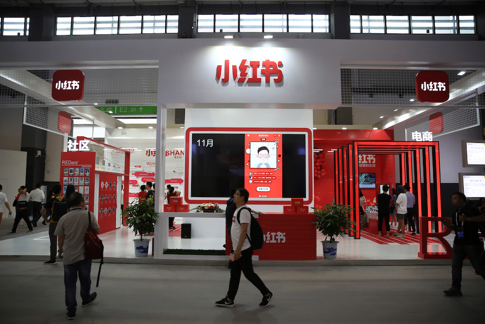 A man walks past the booth of Chinese startup Xiaohongshu, which means 'little red book' in Chinese, at the Big Data Expo in Guiyang, Guizhou province, China May 27, 2019. u00e2u20acu201d Reuters pic