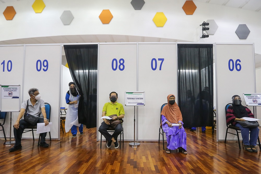 People wait to receive their Covid-19 vaccine jab at the mega vaccination centre located at UiTM in Puncak Alam June 7, 2021. u00e2u20acu201d Picture by Yusof Mat Isa