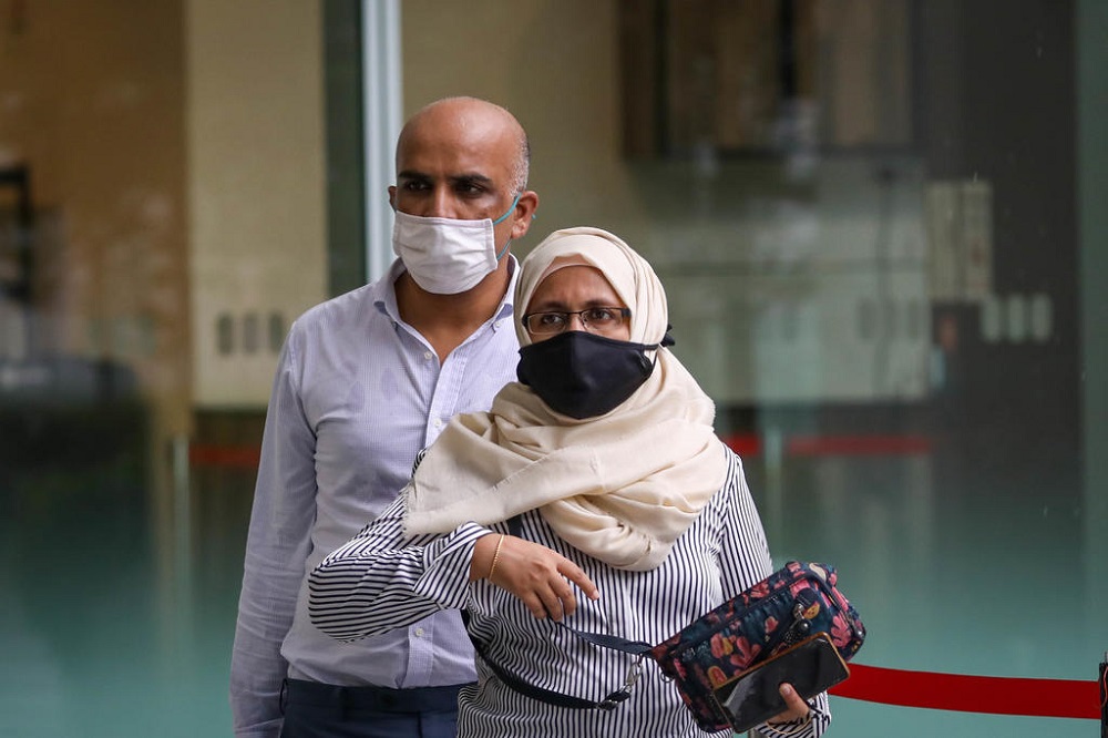 Syed Mohamed Peeran Syed Ameer Hamza (left) and Sabah Parveen outside the State Courts on June 7, 2021. u00e2u20acu201d TODAY pic