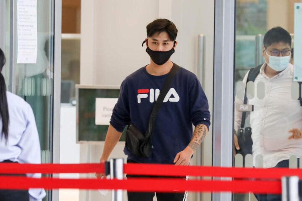 Gabriel Heng Jing Heng leaving the State Courts on April 28, 2021. u00e2u20acu201d TODAY pic