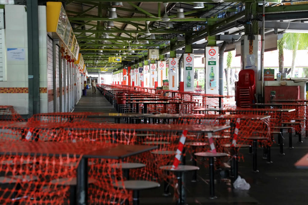 A 79-year-old Singaporean man who is a cleaning worker at public housing blocks in Clementi is now linked to the cluster at the Bukit Merah View market, which has been closed (pictured). u00e2u20acu201d TODAY pic