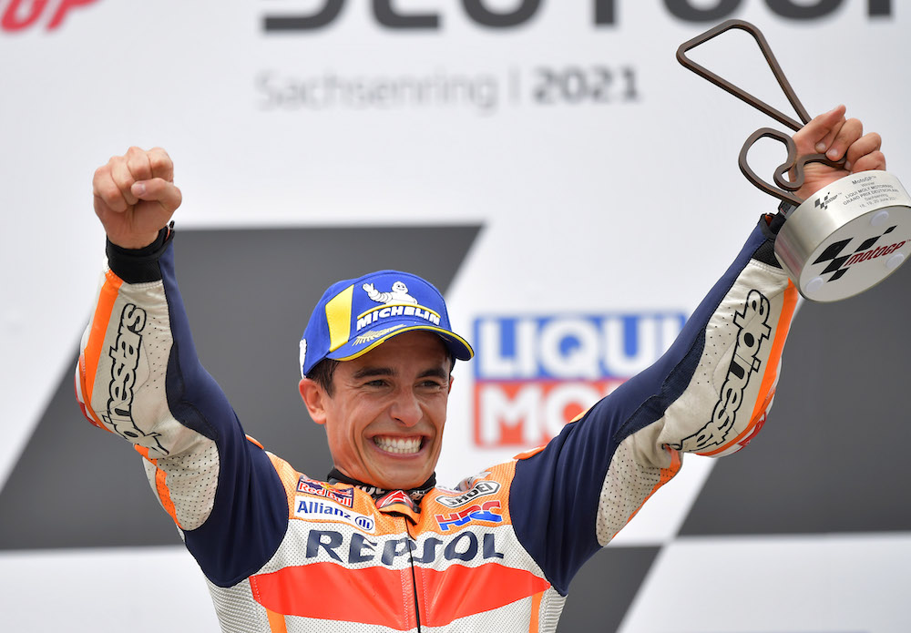 Repsol Honda's Marc Marquez celebrates with a trophy on the podium after winning the German Grand Prix  Sachsenring, Hohenstein-Ernstthal, Germany  June 20, 2021 u00e2u20acu201d Reuters pic