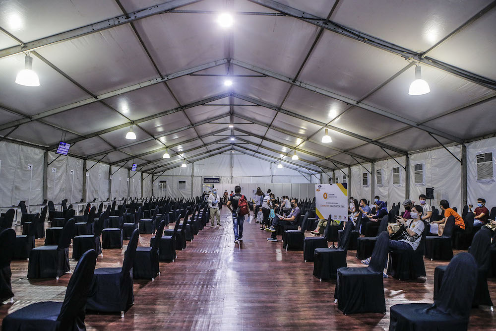 Vaccine recipients rest after receiving the injection at the vaccination centre (PPV) in Bukit Jalil June 27, 2021. u00e2u20acu2022  Picture by Hari Anggaran