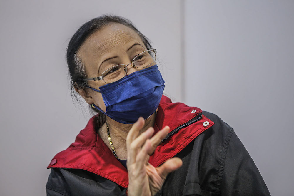 Volunteer Ong Hoon Luan speaks to Malay Mail at the vaccination centre (PPV) in Bukit Jalil June 27, 2021. ―  Picture by Hari Anggara