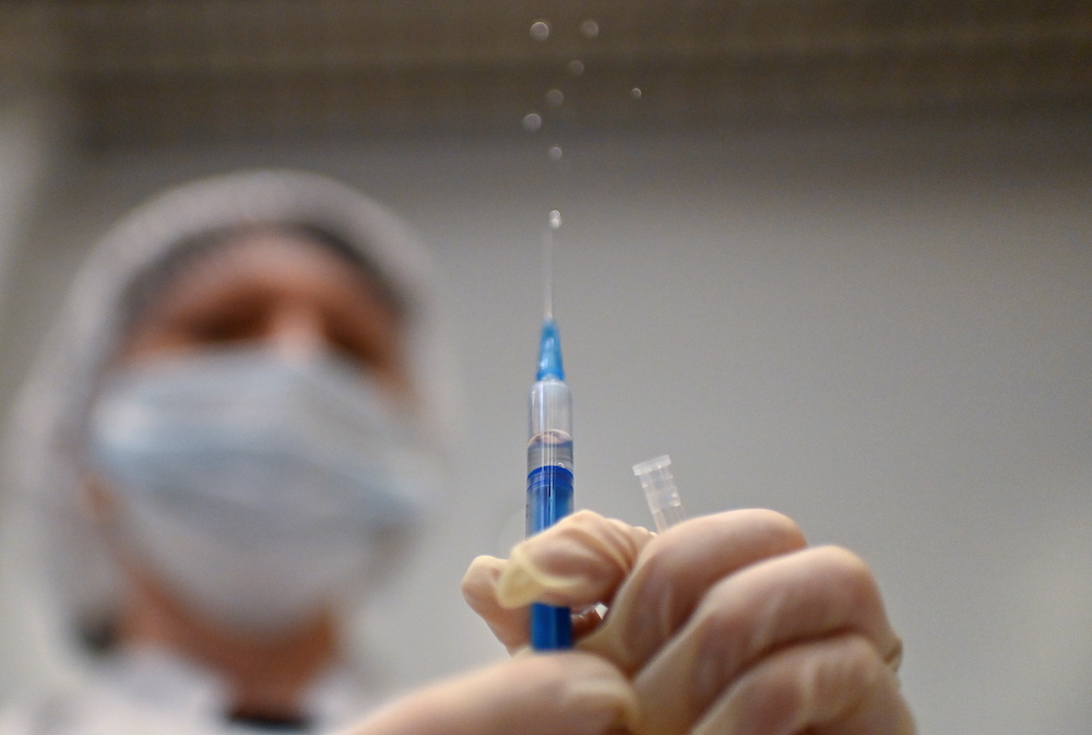 A healthcare worker prepares a dose of Sputnik V (Gam-COVID-Vac) vaccine against the coronavirus disease (Covid-19) in a vaccination centre at a shopping mall in Omsk, Russia, June 29, 2021. u00e2u20acu201d Reuters pic