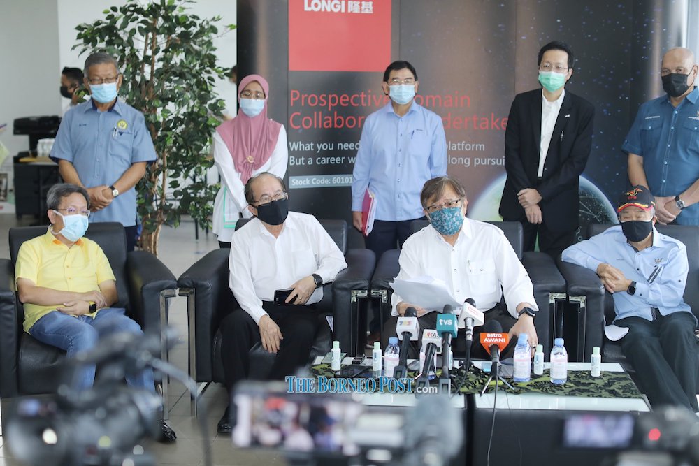 Abang Johari (front second right) addresses the media. From front left are Dr Sim, Ugga, and Mohd Naroden. u00e2u20acu201d Photo by Chimon Upon via Borneo Post