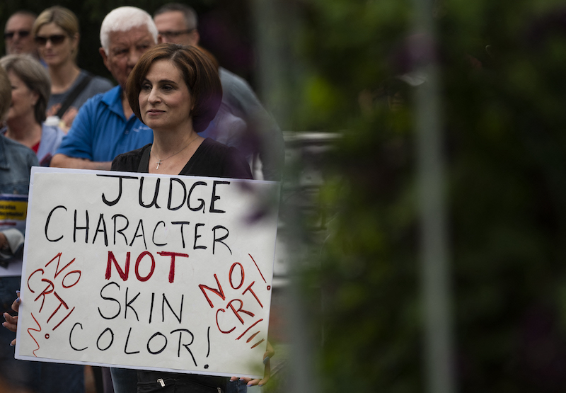 In this file photo taken on June 12, 2021, a woman holds up a sign during a rally against u00e2u20acu02dccritical race theoryu00e2u20acu2122 (CRT) being taught in schools at the Loudoun County Government center in Leesburg, Virginia. u00e2u20acu201d AFP pic