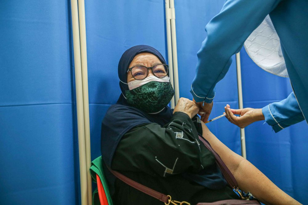A senior citizen receives a dose of the Sinovac Covid-19 vaccine at the Ar-Ridzuan Medical Centre in Ipoh June 7, 2021. u00e2u20acu201d Picture by Farhan Najib
