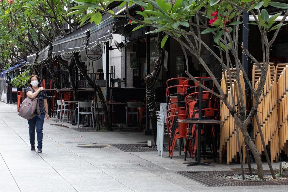 Chairs stacked outside shuttered eateries in China Square Central in May 2020. u00e2u20acu201d TODAY pic