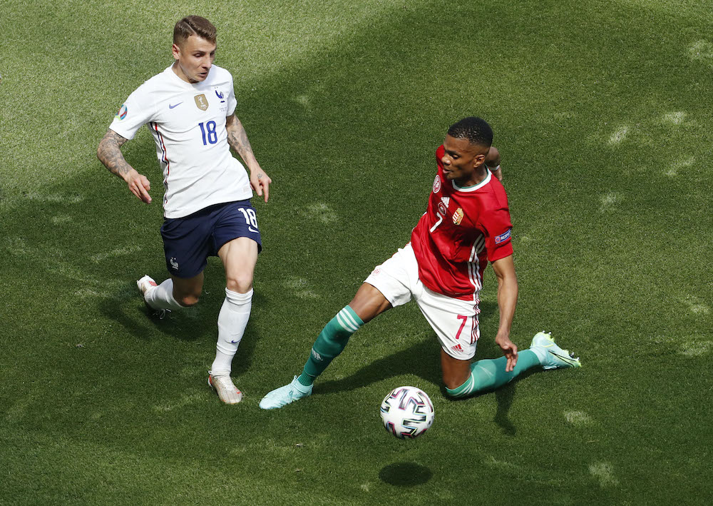 Franceu00e2u20acu2122s Lucas Digne in action with Hungaryu00e2u20acu2122s Loic Nego Pool during the Euro 2020 Group F match at the Puskas Arena in Budapest, Hungary, June 19, 2021. u00e2u20acu201d Reuters picnn