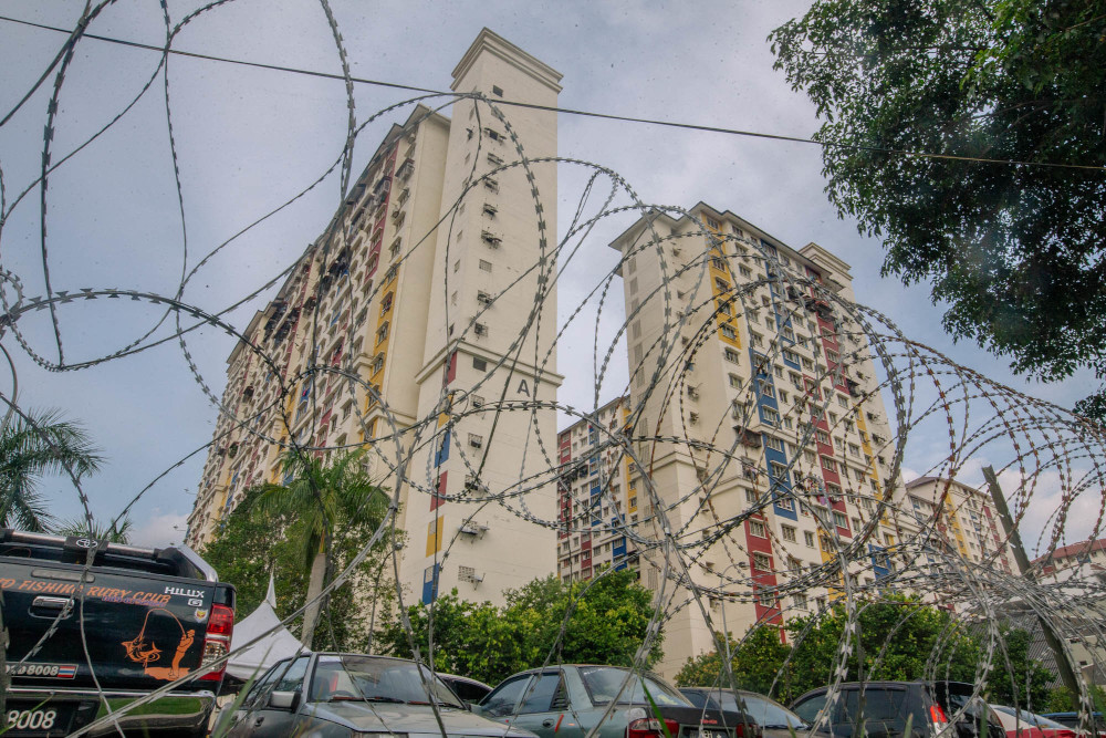 Barbed wire is seen around PPR Desa Rejang in Kuala Lumpur after EMCO was imposed on the area, June 18, 2021. u00e2u20acu201d Picture by Firdaus Latif