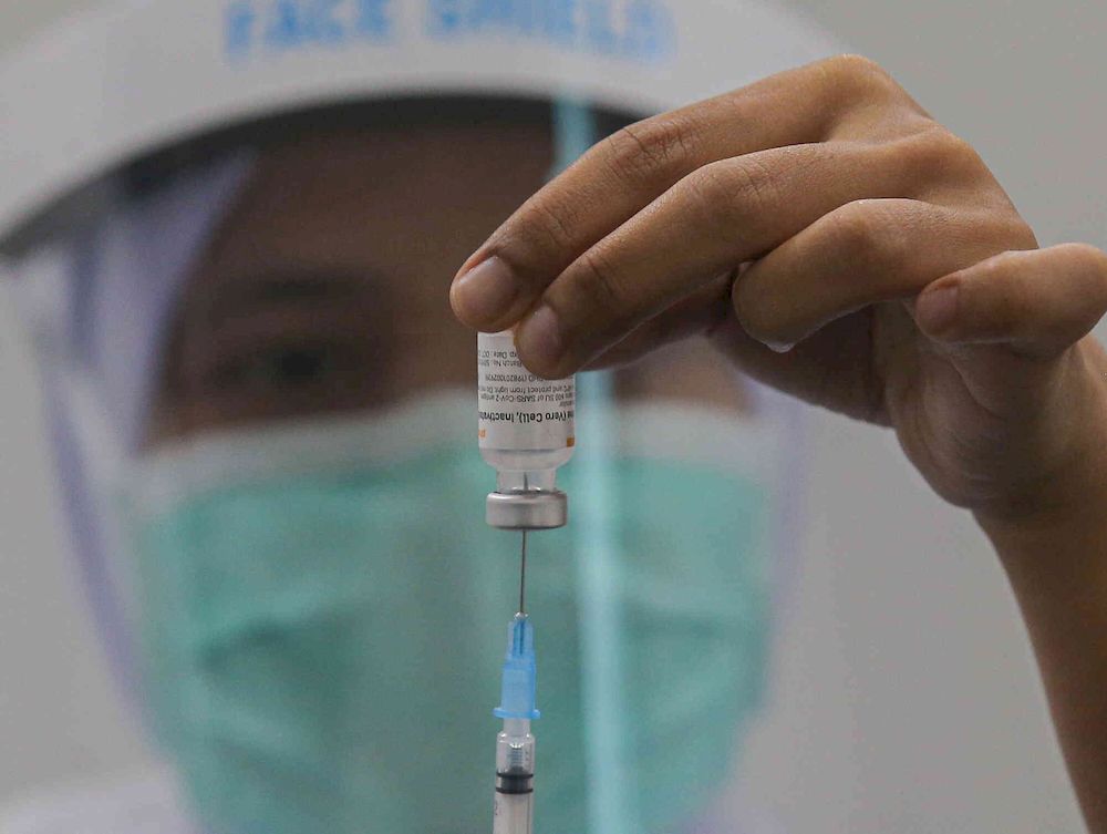 The second phase of vaccination under the National Immunisation Programme going smoothly according to schedule at the vaccination centre (PPV) Stadium Indera Mulia in Ipoh, Perak on June 4, 2021. u00e2u20acu201d Picture by Farhan Najib